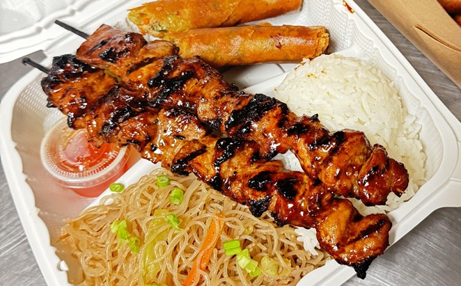 EAT RIGHT: Capuno’s Lutong Bahay offers combination plates of Filipino classics, such as skewers of grilled pork cooked with the family’s barbecue recipe, pancit (noodles and vegetables in a sweet, spicy sauce), rice, and lumpia (a Filipino egg roll).