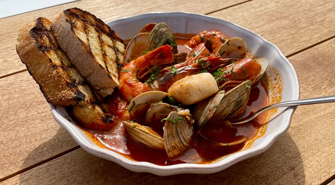 FAN FAVORITE: Cypress Beach House’s cioppino, based on the San Francisco original, features ample fresh seafood in a spicy white-wine tomato broth. Soak up the last drops with grilled sourdough bread.