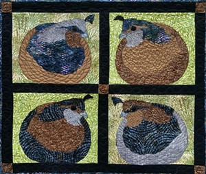 The walls of the California Nature Art Museum are decorated with quilts depicting animal scenes