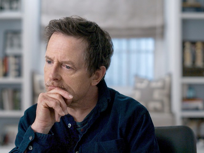 STILL HERE: In Still: A Michael J. Fox Movie, director Davis Guggenheim mixes film clips and reenactments, over which Fox narrates what it’s been like to spend 30 years with Parkinson’s disease, streaming on Apple TV Plus.